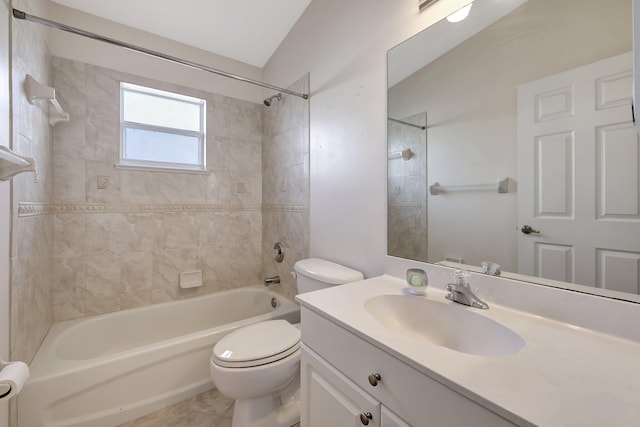 full bathroom with vanity, toilet, tiled shower / bath, and vaulted ceiling