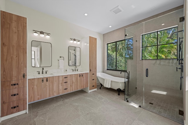 bathroom featuring vanity and separate shower and tub