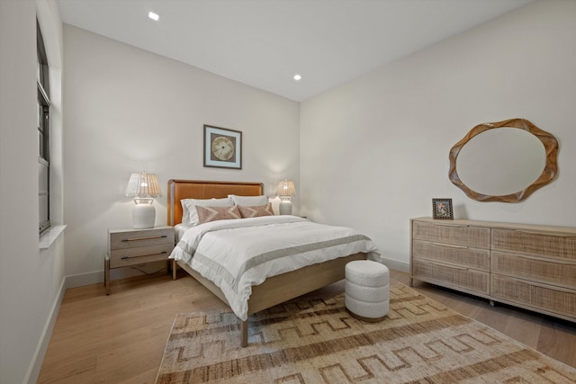 bedroom with light wood-type flooring