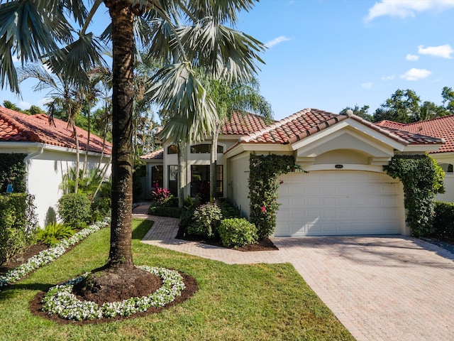 mediterranean / spanish-style home featuring a garage