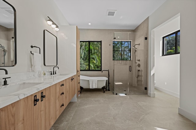 bathroom with toilet, plenty of natural light, vanity, and walk in shower