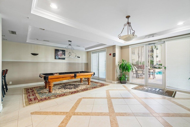 rec room with a tray ceiling, light tile patterned floors, ornamental molding, and billiards