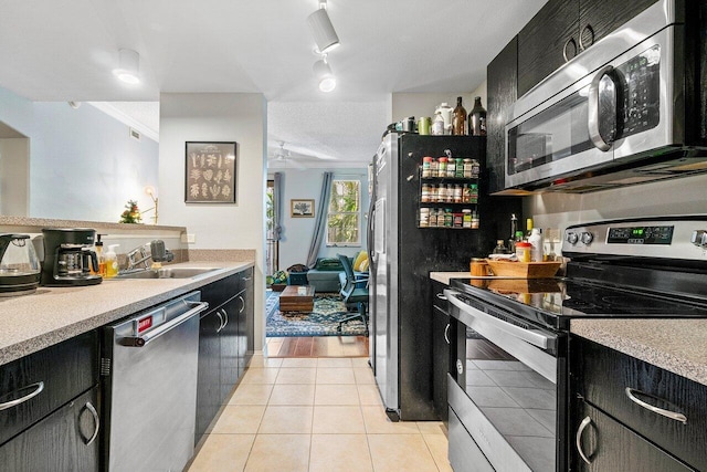 kitchen featuring sink, stainless steel appliances, and light wood-type flooring