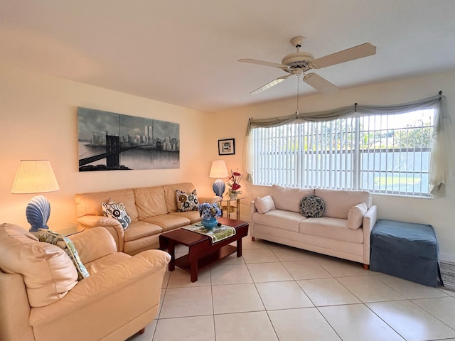 living room featuring light tile patterned floors and ceiling fan