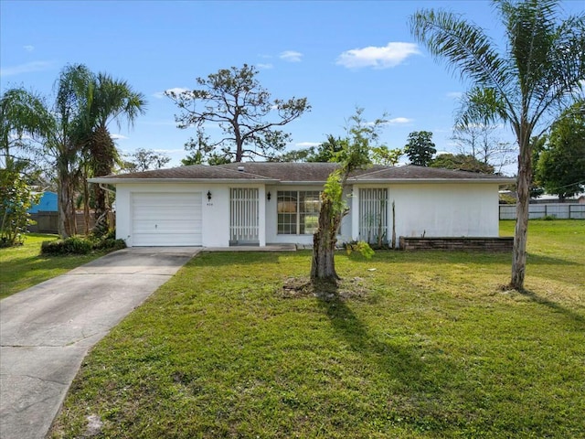 single story home with an attached garage, driveway, and a front lawn