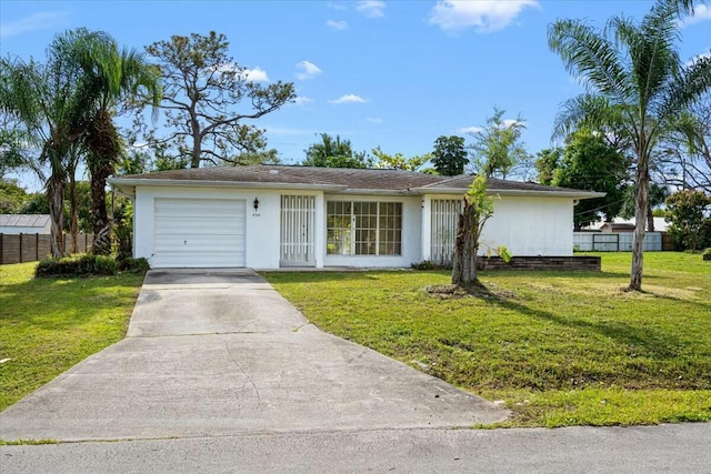 single story home with a garage, driveway, and a front yard