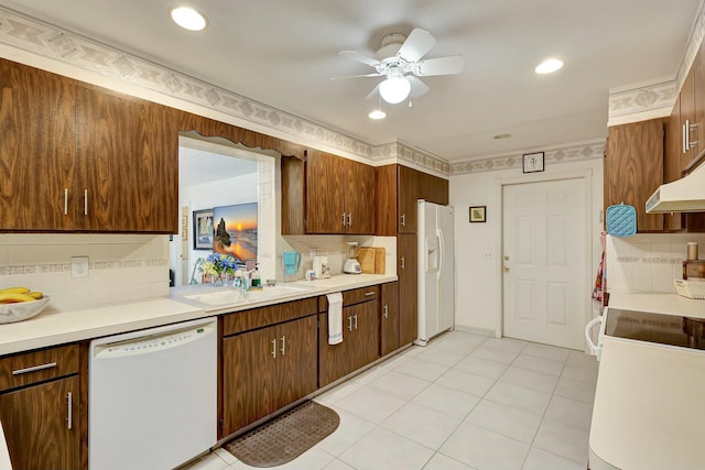 kitchen featuring tasteful backsplash, white appliances, ceiling fan, sink, and light tile patterned floors