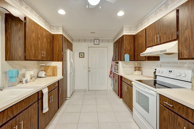 kitchen with ceiling fan, sink, backsplash, white appliances, and light tile patterned floors