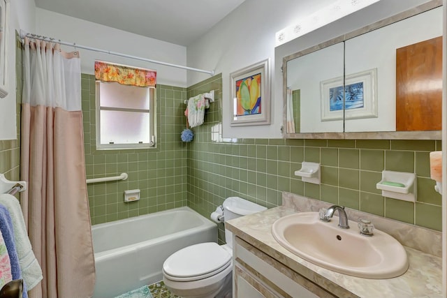 full bathroom featuring vanity, shower / bathtub combination with curtain, toilet, and tile walls