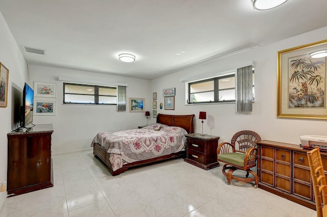 bedroom featuring multiple windows