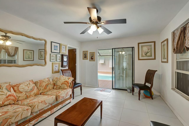 living room with light tile patterned floors and ceiling fan