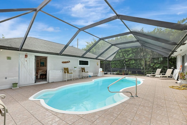 view of pool with a lanai and a patio area