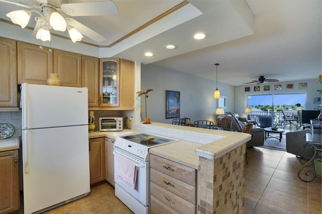 kitchen with decorative backsplash, ceiling fan, white appliances, and kitchen peninsula