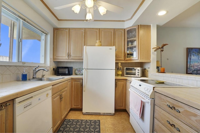 kitchen featuring tile countertops, sink, white appliances, and light brown cabinets