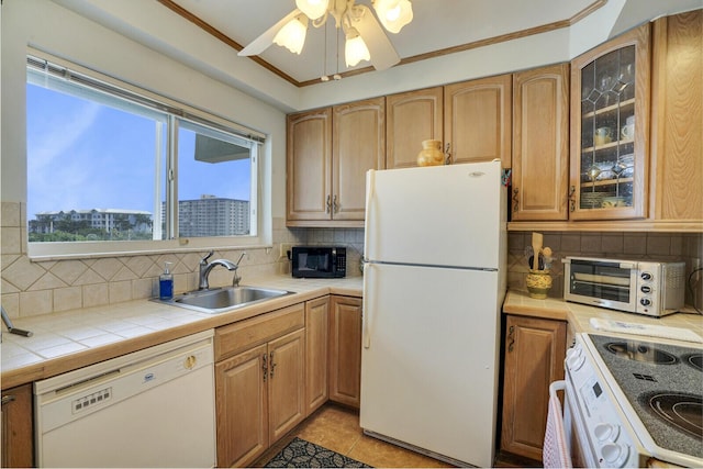 kitchen featuring white appliances, sink, ceiling fan, light tile patterned floors, and tasteful backsplash