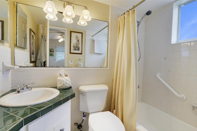 full bathroom featuring tasteful backsplash, shower / bath combination with curtain, toilet, vanity, and tile walls