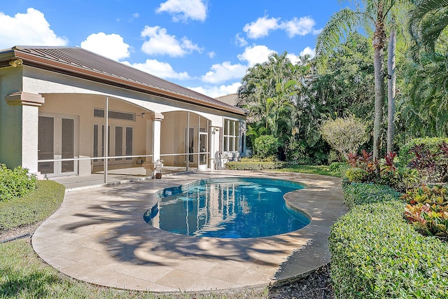 view of swimming pool with a patio area