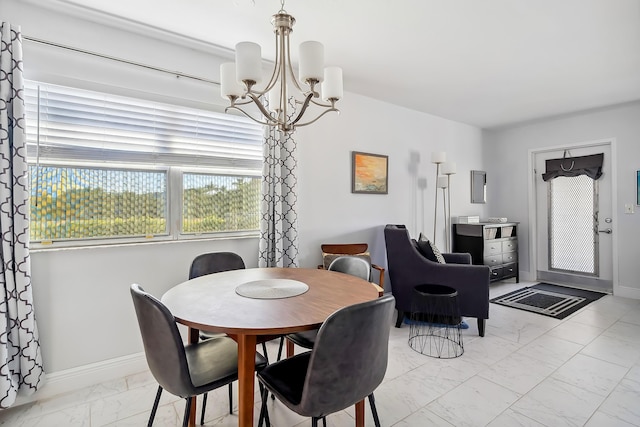 dining space with a notable chandelier