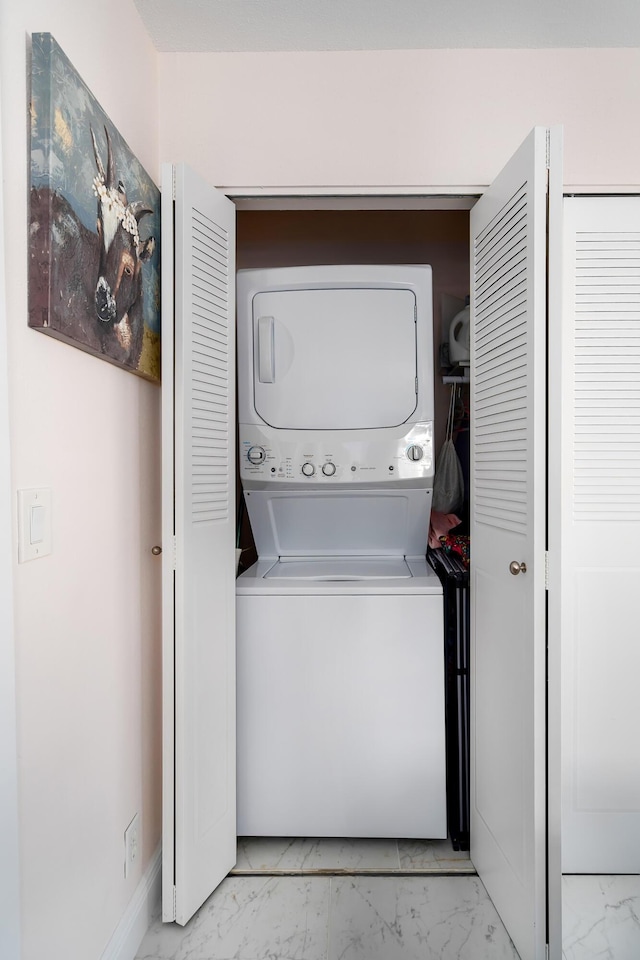 washroom with stacked washer / dryer