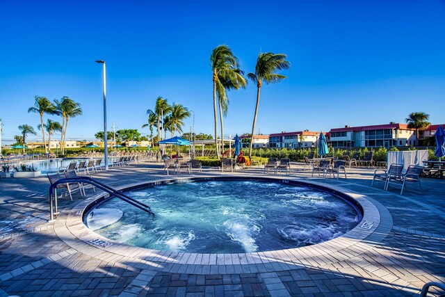 view of pool with a community hot tub