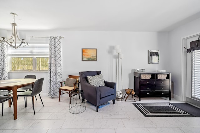 living area with an inviting chandelier