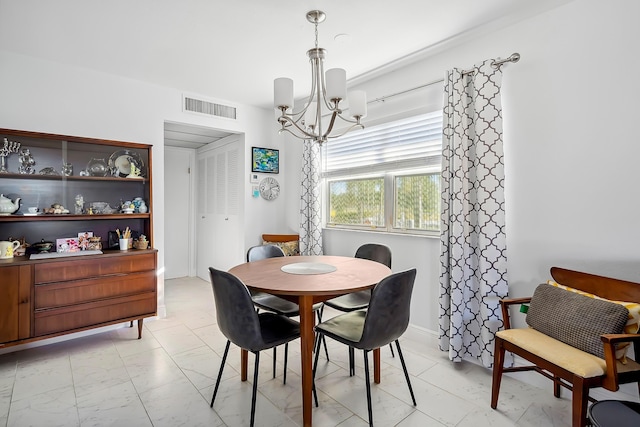 dining area featuring a chandelier