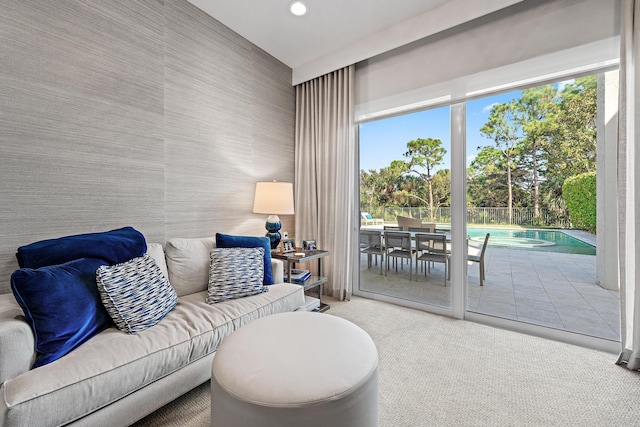 carpeted living area featuring recessed lighting