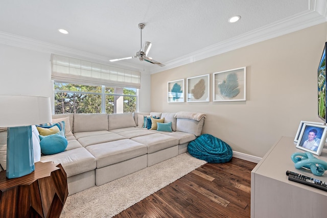 living area featuring ceiling fan, recessed lighting, dark wood-style flooring, baseboards, and ornamental molding