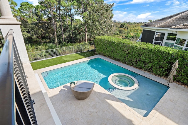 view of pool featuring a sunroom, a patio area, a fenced backyard, and a pool with connected hot tub