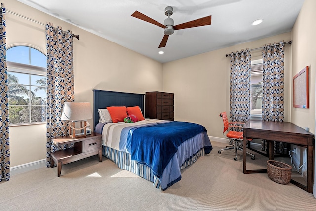 carpeted bedroom with ceiling fan, baseboards, and recessed lighting