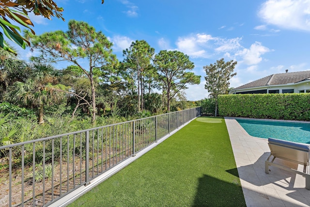 view of yard featuring a fenced backyard, a fenced in pool, and a patio