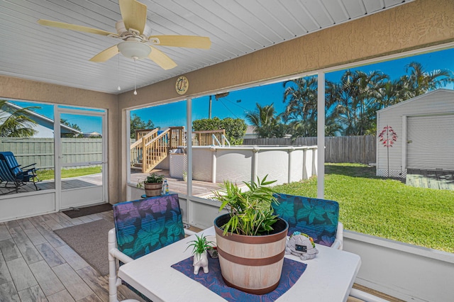 sunroom featuring ceiling fan