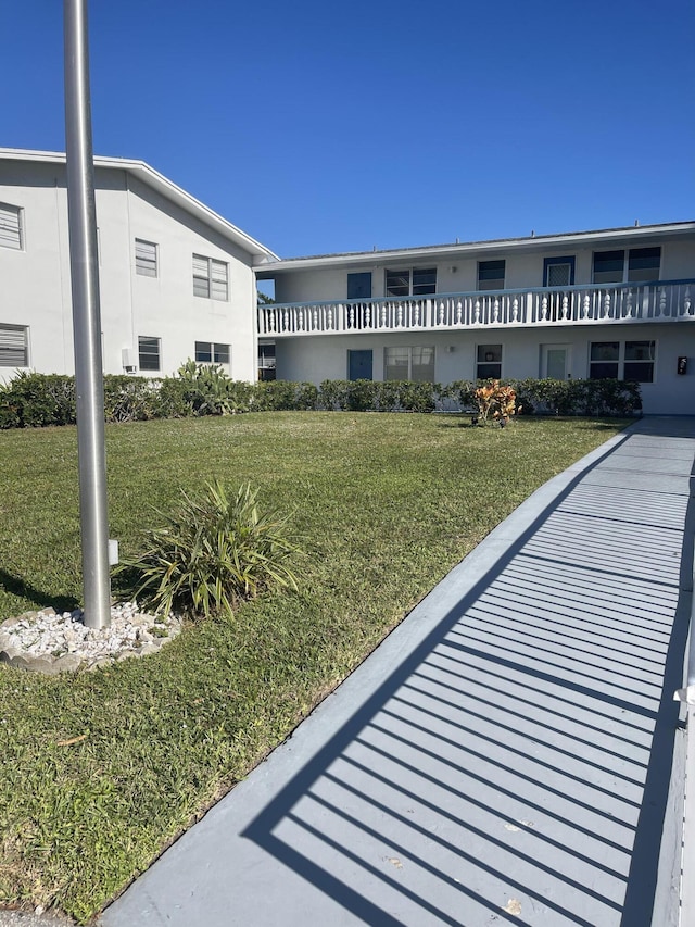 view of community featuring a lawn