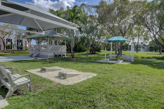 view of home's community featuring a gazebo, a yard, and a wooden deck