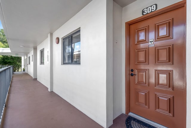 doorway to property with a porch