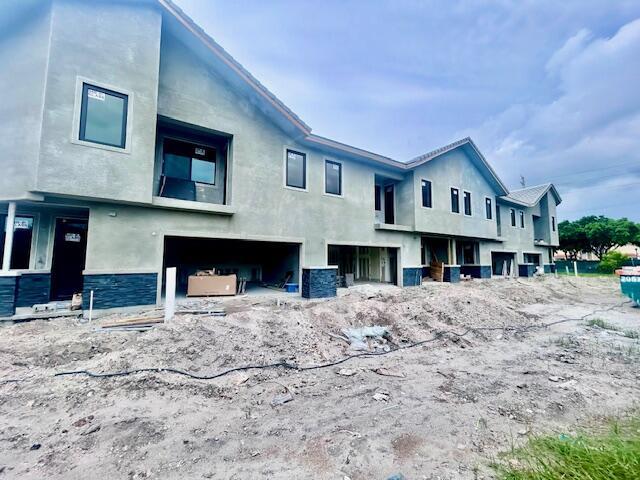 6991 NW 30th Ter Unit A, Fort Lauderdale, FL 33309 - rear view of house with stucco siding