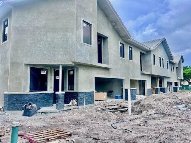 6991 NW 30th Ter Unit A, Fort Lauderdale, FL 33309 - rear view of property with stone siding and stucco siding