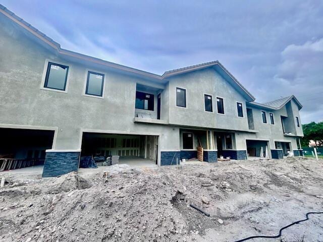6991 NW 30th Ter Unit A, Fort Lauderdale, FL 33309 - rear view of property featuring stucco siding
