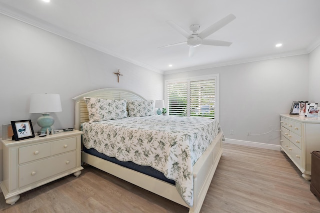 bedroom featuring ceiling fan, light wood-type flooring, and crown molding