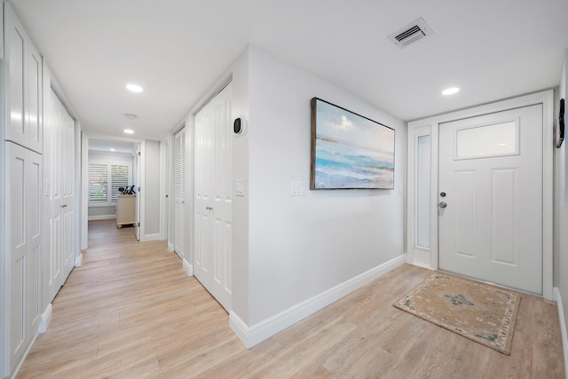 foyer with light hardwood / wood-style flooring