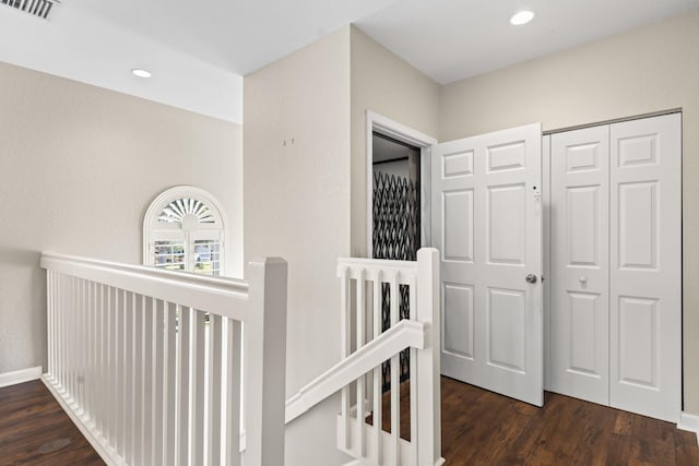 hall with dark hardwood / wood-style flooring