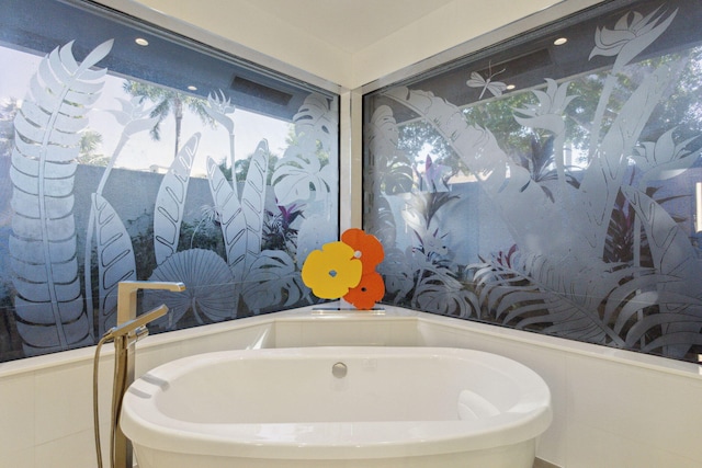 bathroom featuring a bath and sink