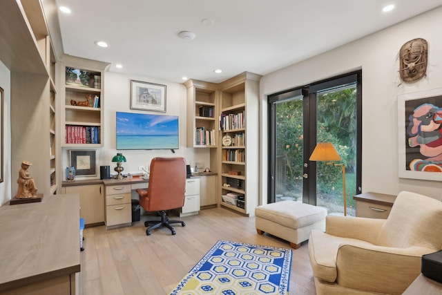 office with light hardwood / wood-style floors