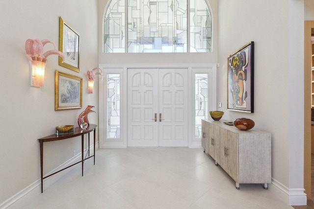 foyer featuring a high ceiling