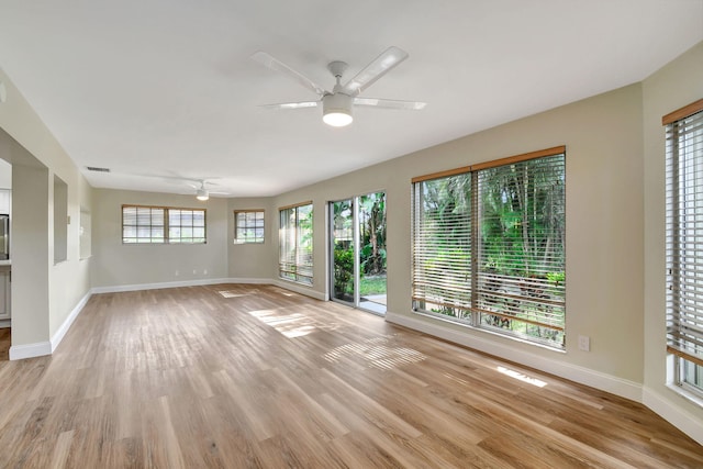 unfurnished living room with light hardwood / wood-style floors and ceiling fan