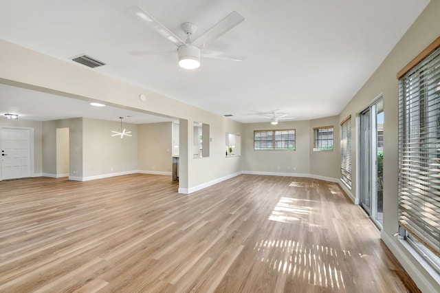 unfurnished living room with ceiling fan and light hardwood / wood-style floors