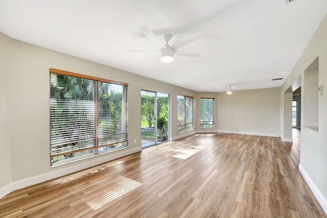 interior space with ceiling fan and light hardwood / wood-style flooring