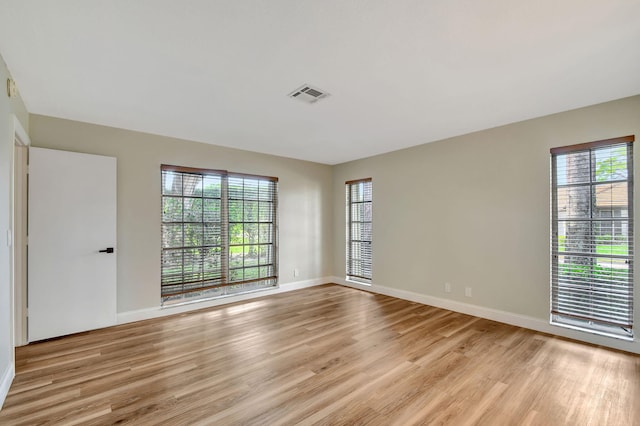 spare room with light hardwood / wood-style floors