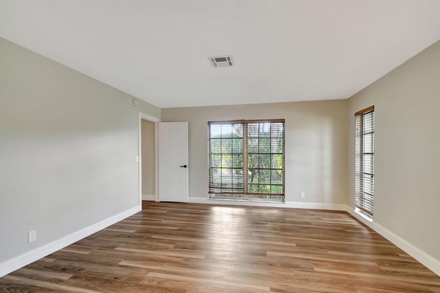 spare room featuring hardwood / wood-style floors