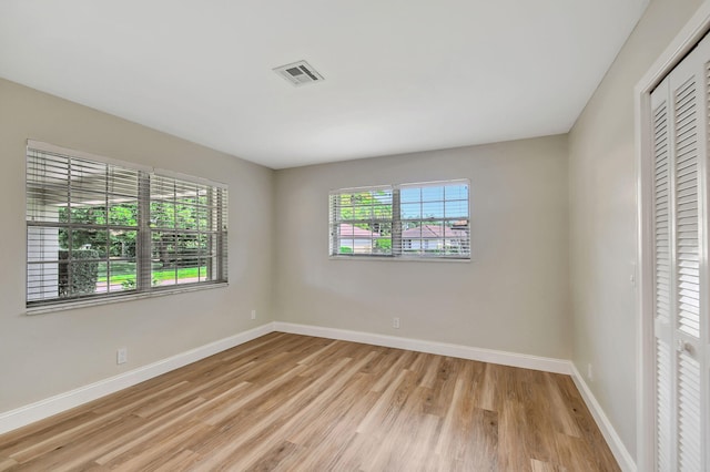 unfurnished room featuring light hardwood / wood-style floors